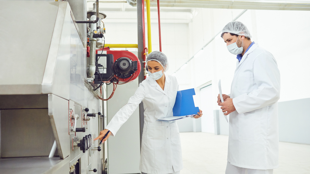 two technicians inspecting equipment