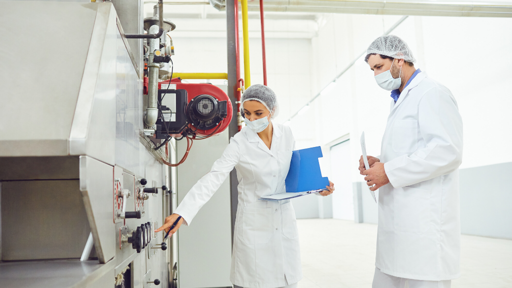 two technicians inspecting equipment 