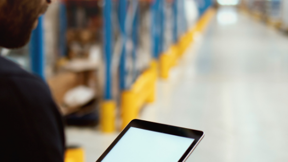 man holding tablet in warehouse