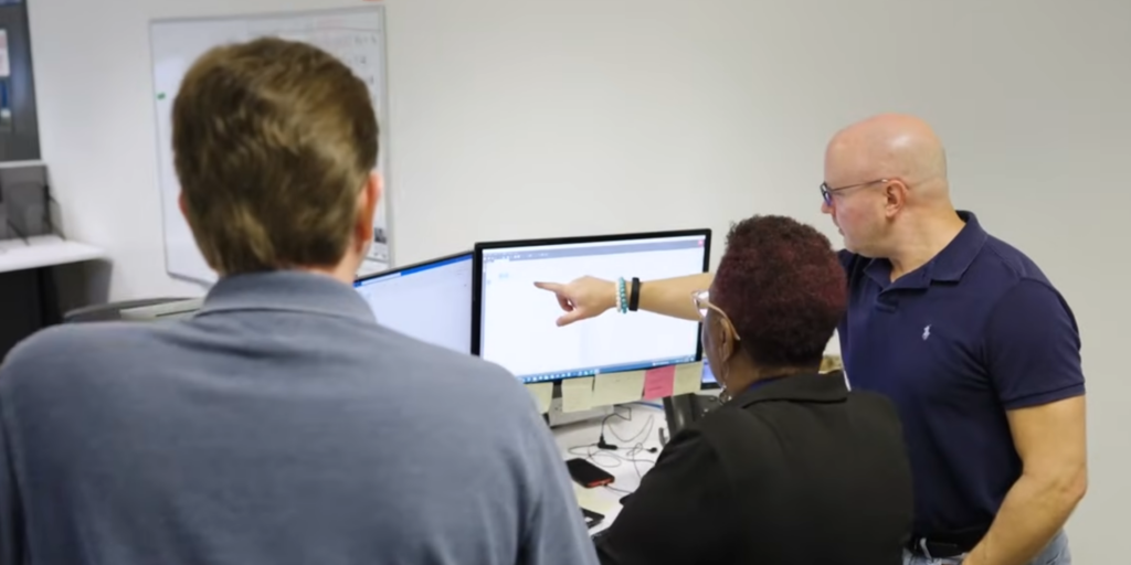 Employees at Benchmark using Infor CloudSuite Industrial.